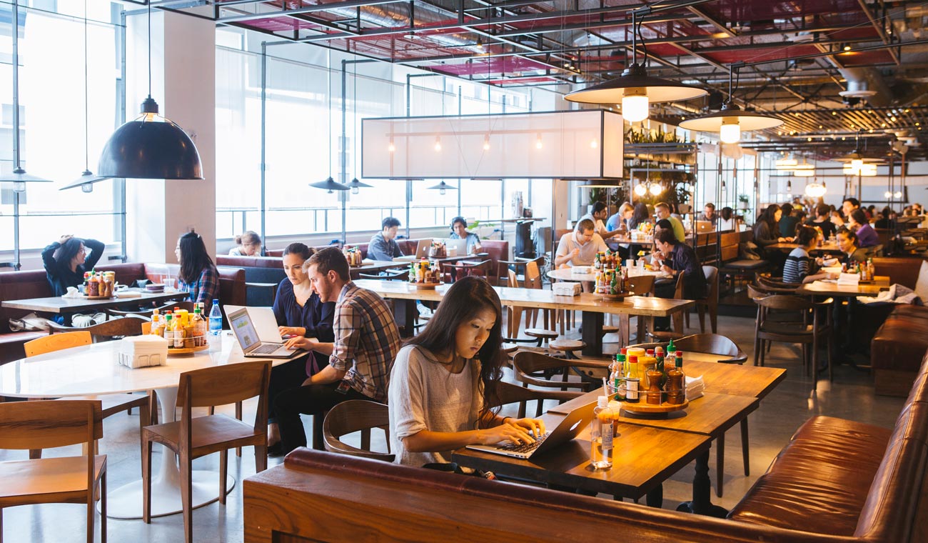 Photo of people working in the San Francisco headquarters of Dropbox