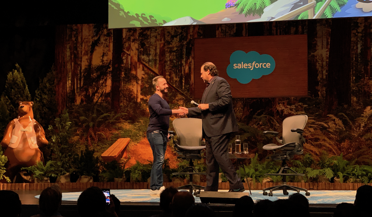 Drew Houston and Marc Benioff shake hands at Dreamforce 2018