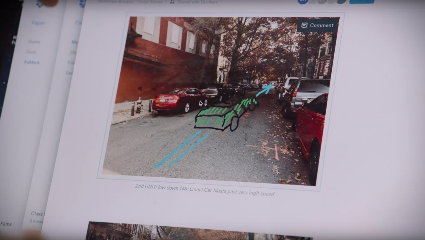 Screenshot of photo of street with drawing of car's path overlaid, shown in Dropbox Paper