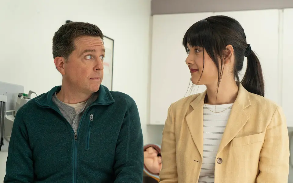 Photo of Ed Helms and Patti Harrison in a scene from the film Together, Together
