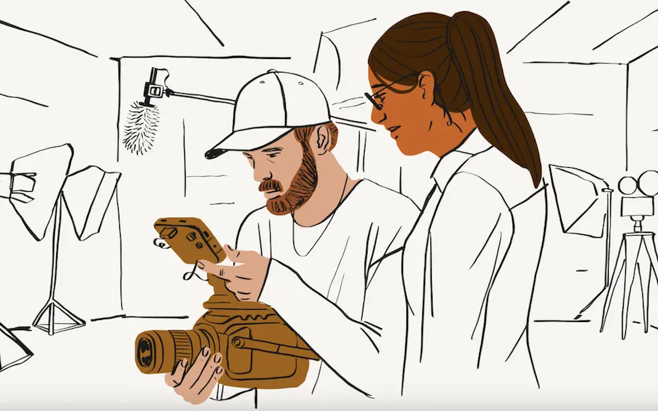 Illustration of two coworkers reviewing a video