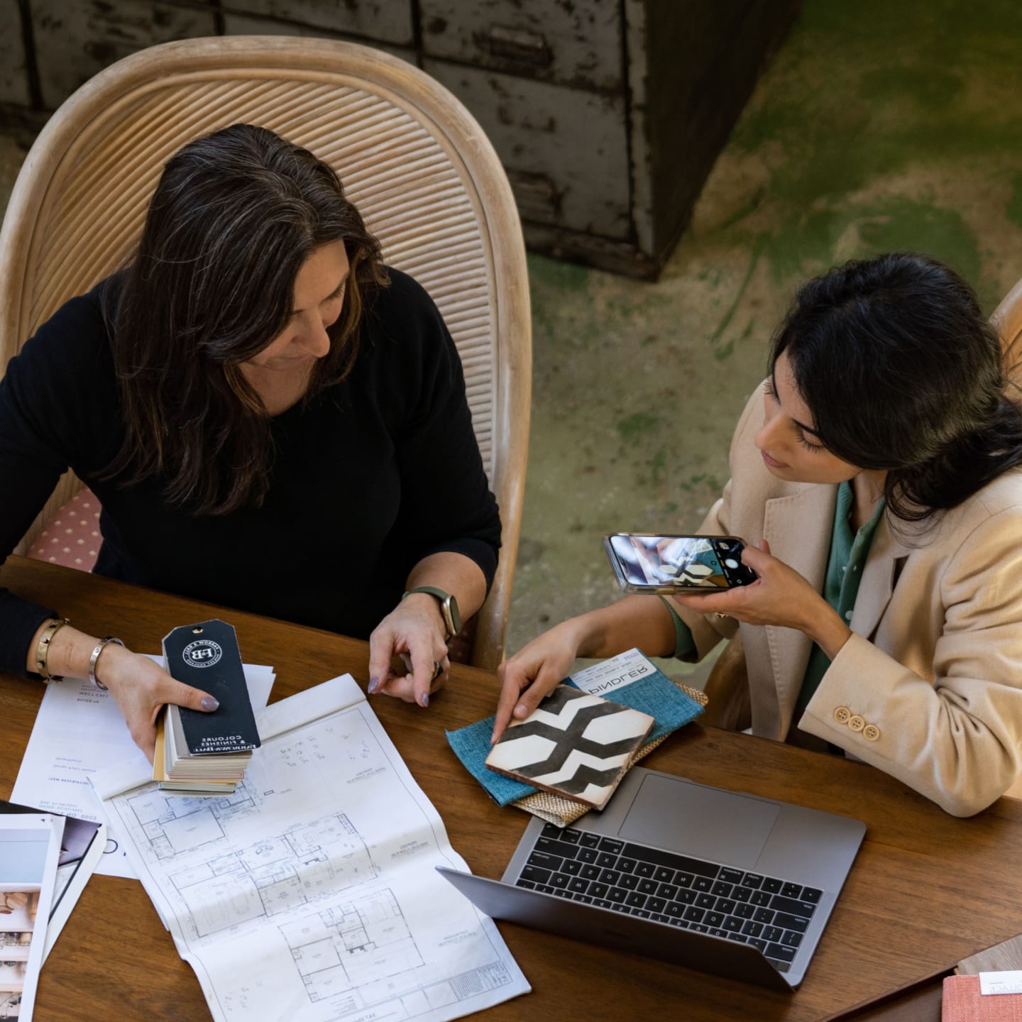 Two people working on a project and scanning documents