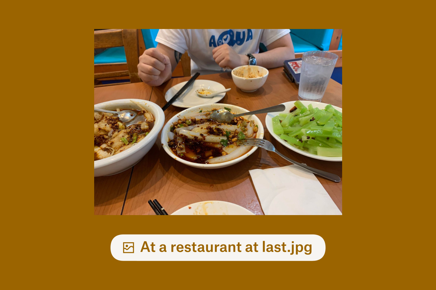 Plates of Szechuan food on a table at a restaurant