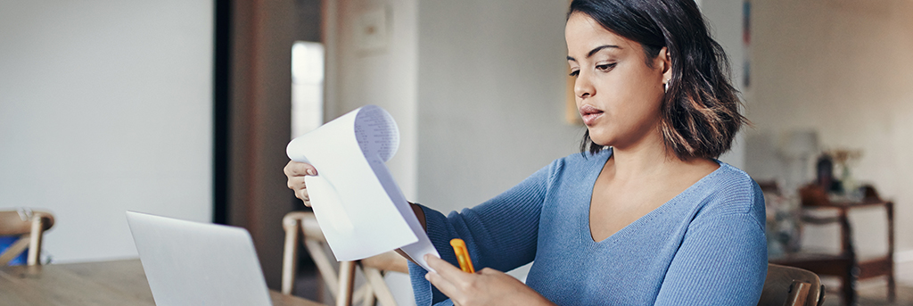 Woman works on laptop while working from home