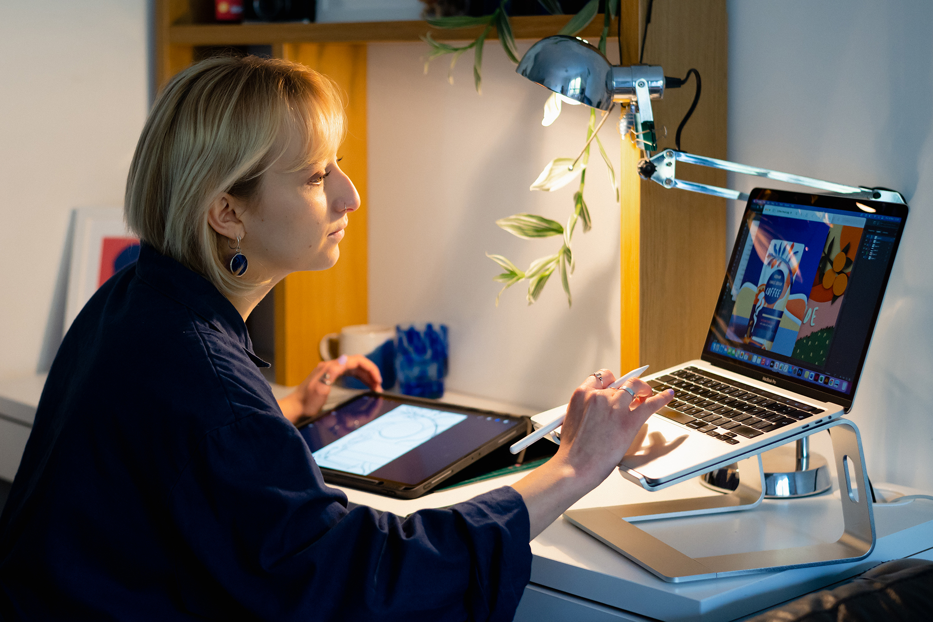 Woman works on creative assets on her laptop