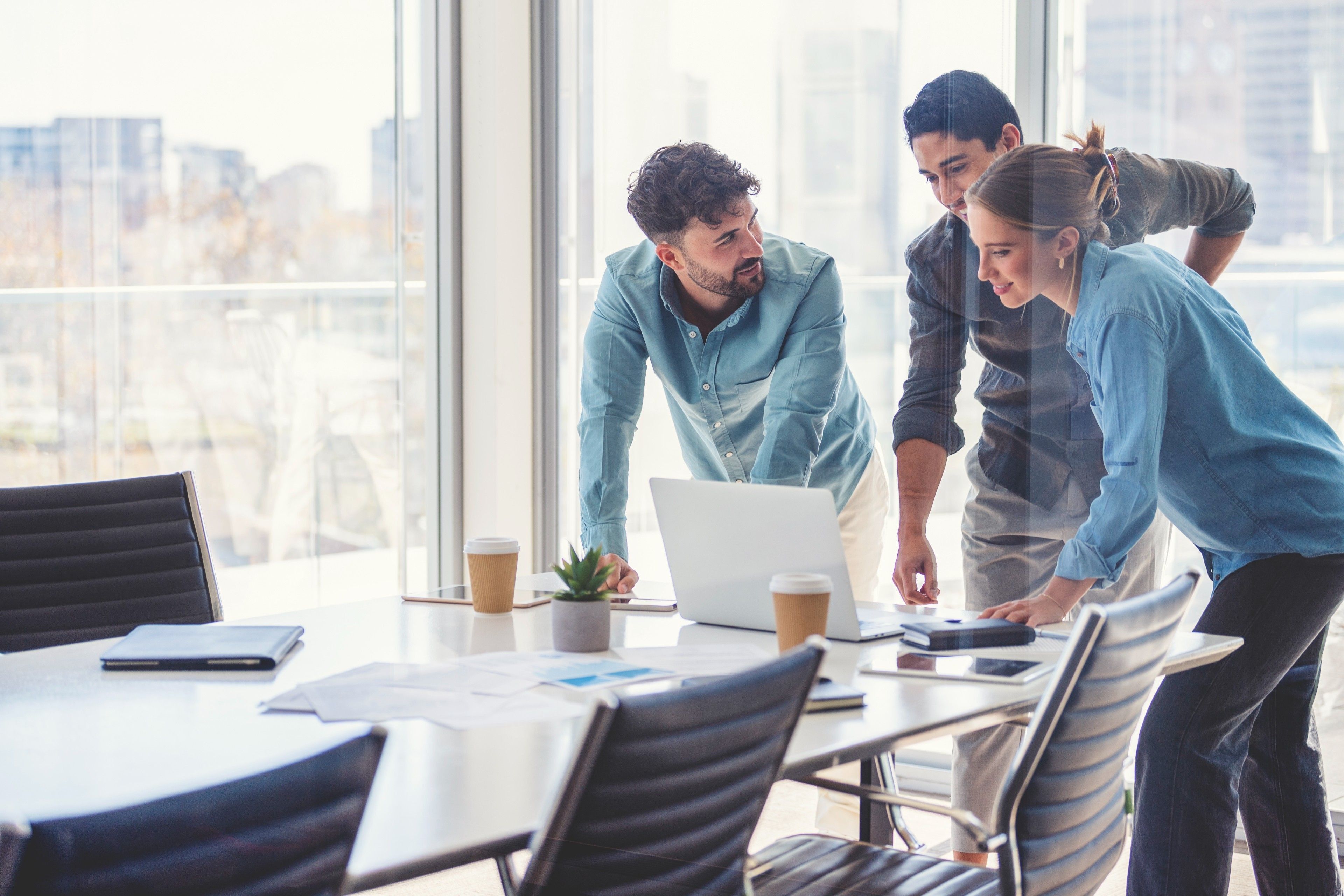 A team takes a moment to finalise their pitch in the boardroom before the big moment.