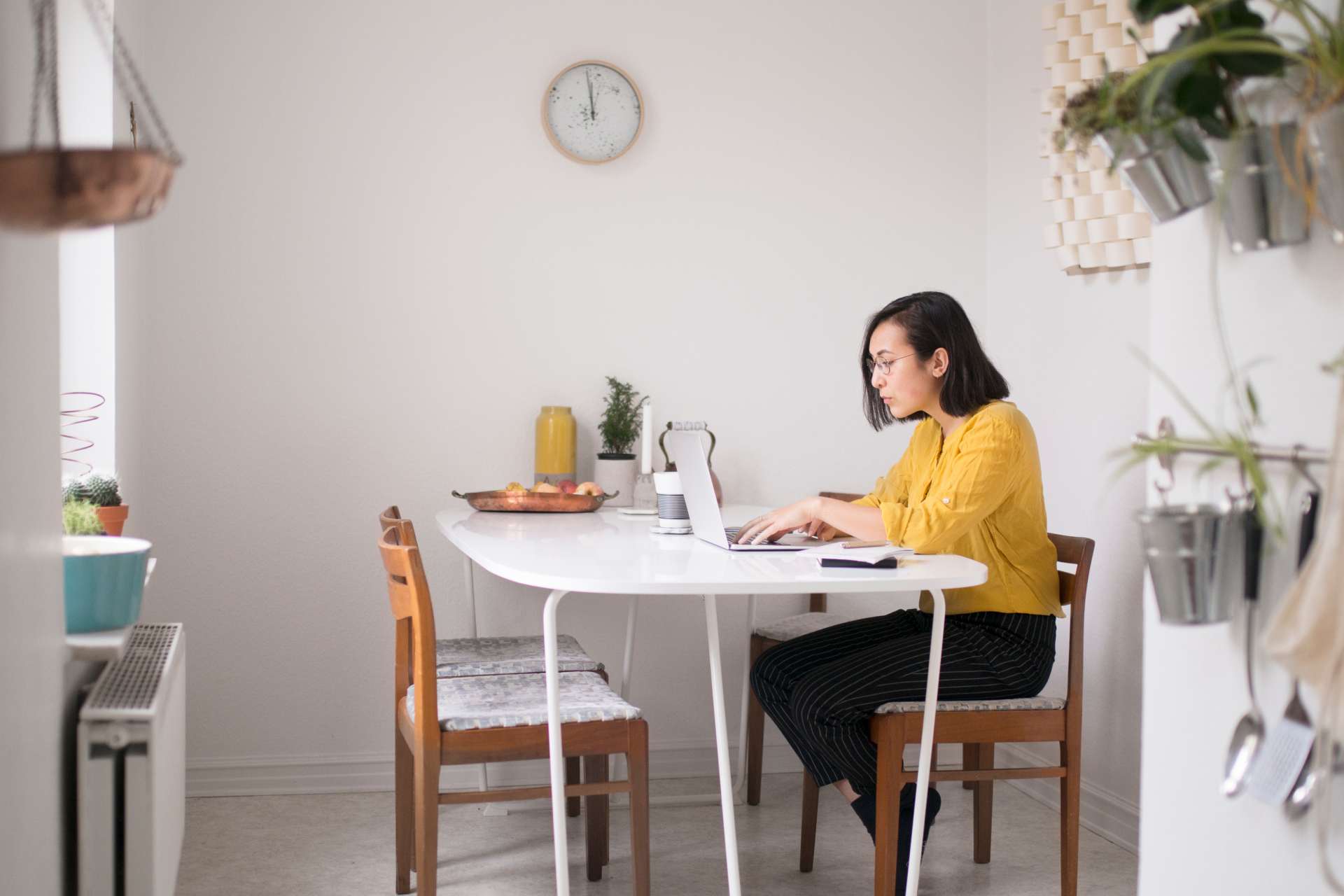 A person works on a new version of a file from their home workspace