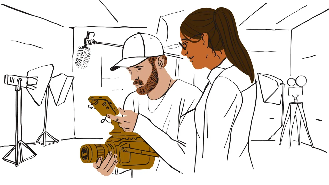 An illustration of two creatives in a studio using a film camera to create a video.