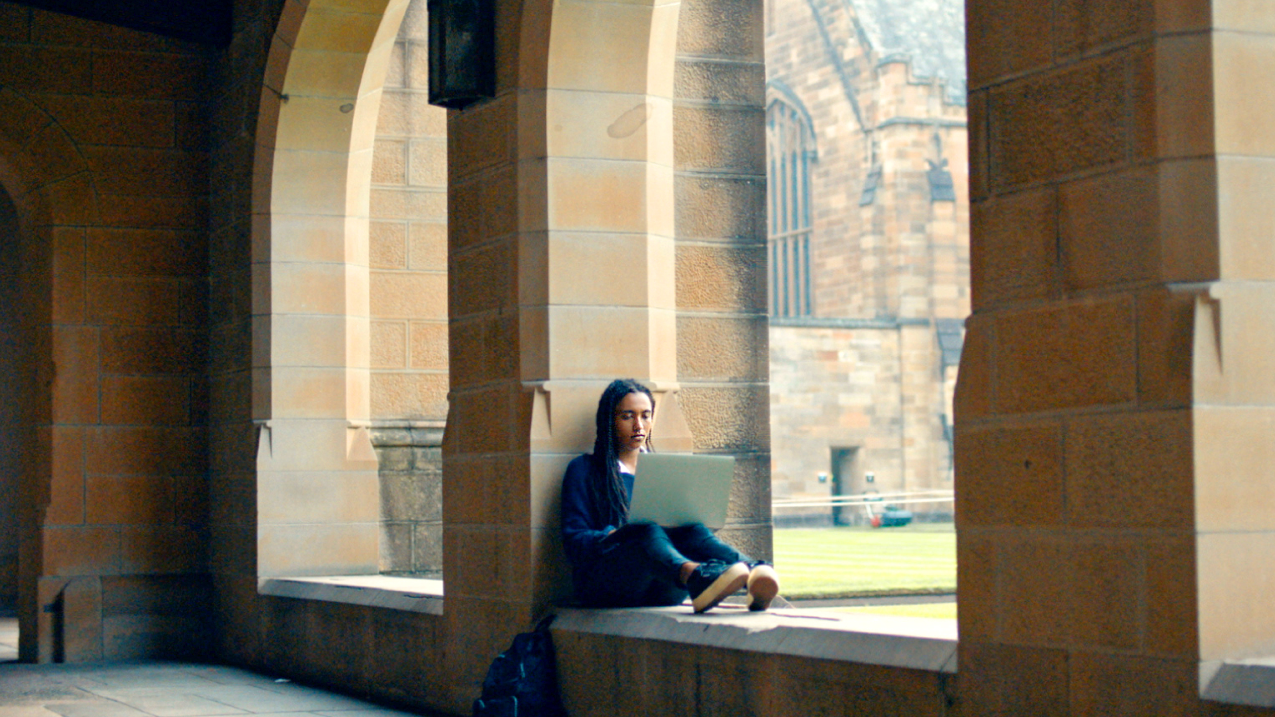 A person using their laptop outside