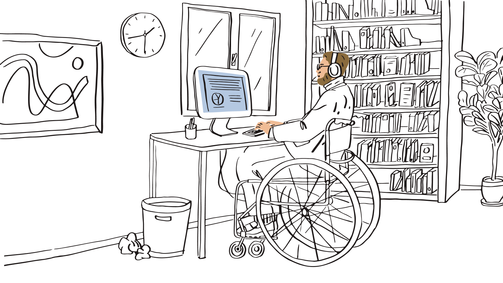 Person sits in a wheelchair working at a desk on their computer, beside them there is a large clock on the wall